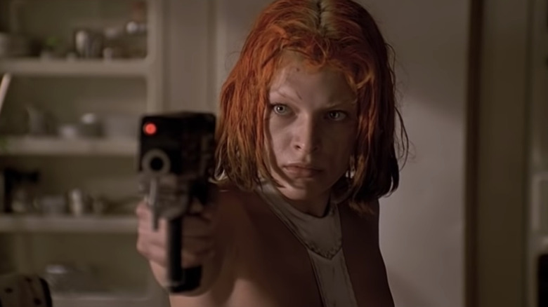 Leeloo raises a pistol in "The Fifth Element" (1997)