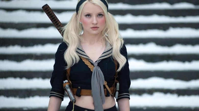 Babydoll walks down stairs with sword on her back in "Sucker Punch" (2011)