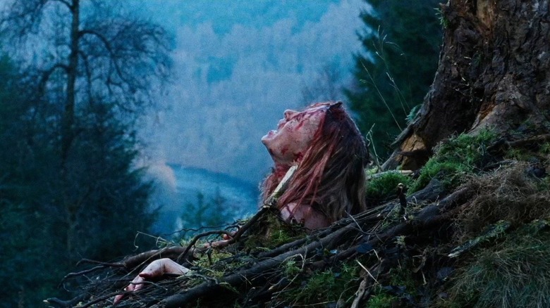 Sarah emerging from the pit in The Descent (2005)