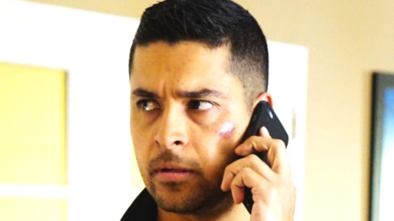 Special Agent Torres talking on the phone