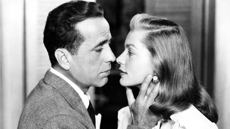Humphrey Bogart kissing Lauren Bacall