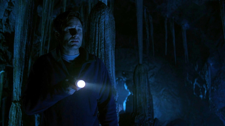 Mulder holding flash light