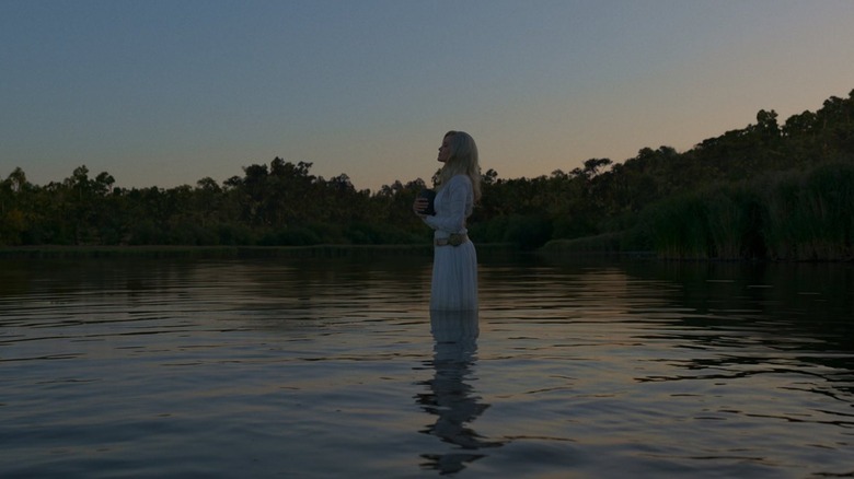 Thena prepares to part with Gilgamesh's ashes in "Eternals" (2021)