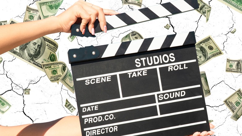 Hand holding clapperboard