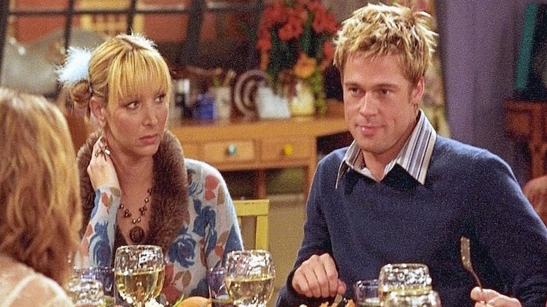 Brad Pitt sits at dinner table Friends