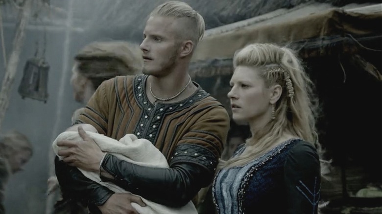 Bjorn Ironside holding Siggy next to Lagertha