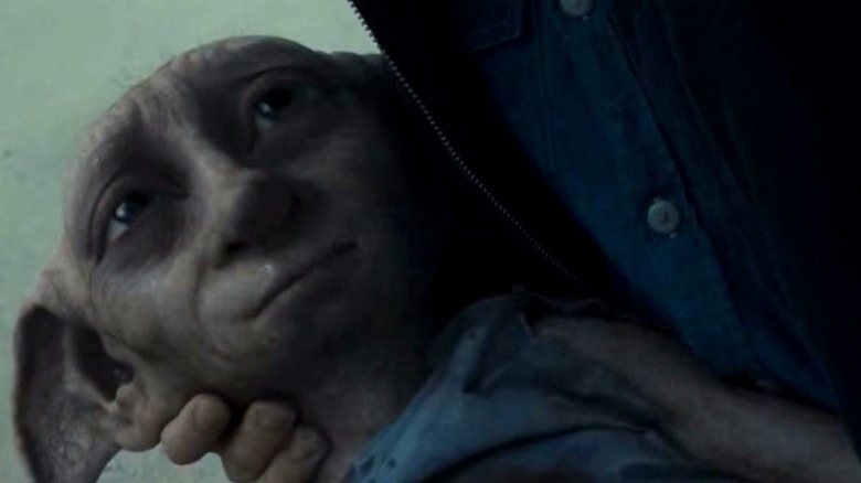 Dobby smiling in harrys arms Harry Potter