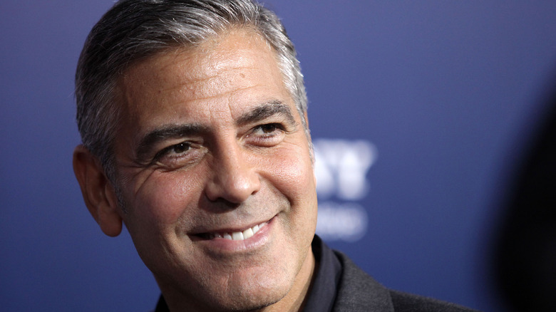 George Clooney smiling at event
