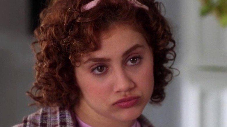 Brittany Murphy smirks cocks head
