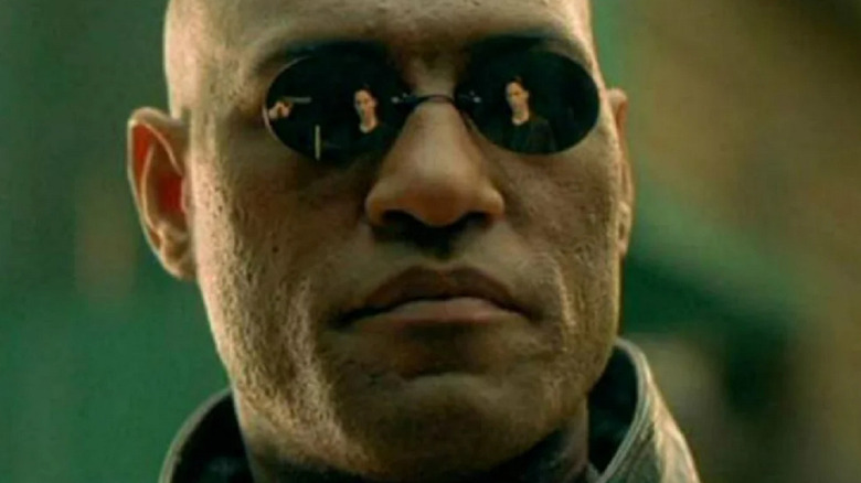Morpheus with Neo reflected in his sunglasses