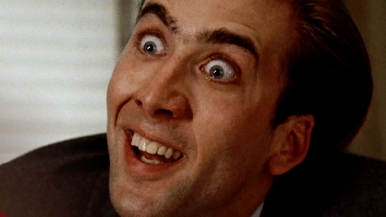 Nicolas Cage wide-eyed with creepy smile