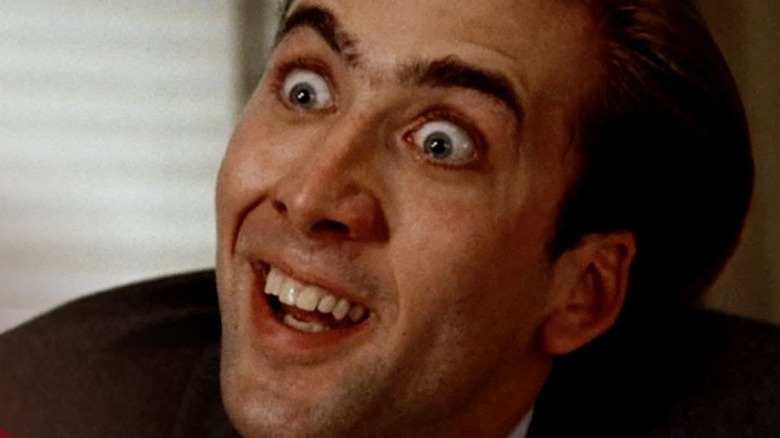 Nicolas Cage wide-eyed with creepy smile