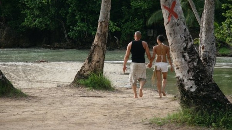 Dom and Letty kiss on beach