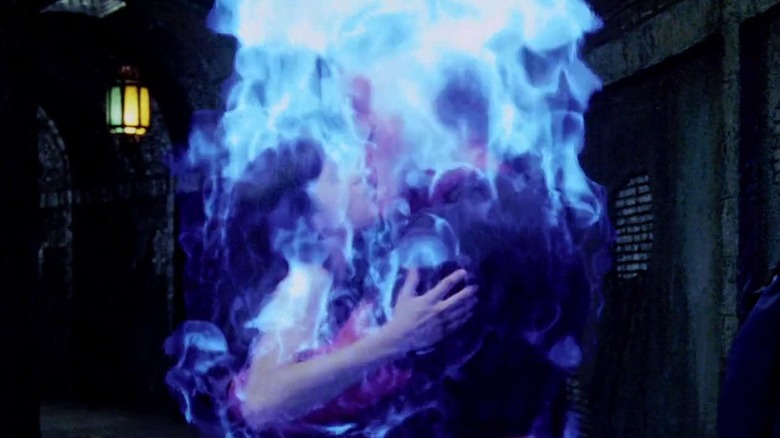 Selma Blair as Liz Sherman, Ron Perlman as Hellboy, and Rupert Evans as John Myers in Hellboy