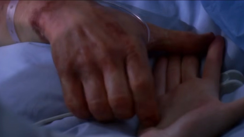 George grabbing hand on Grey's Anatomy