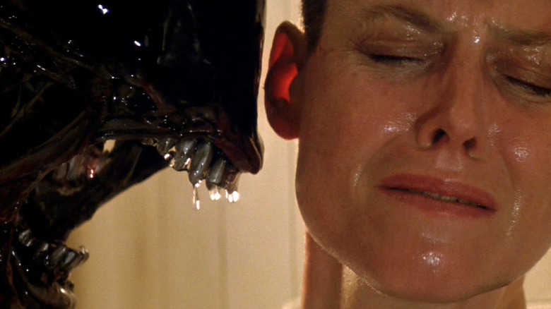 Xenomorph snarling inches from Ripley's face