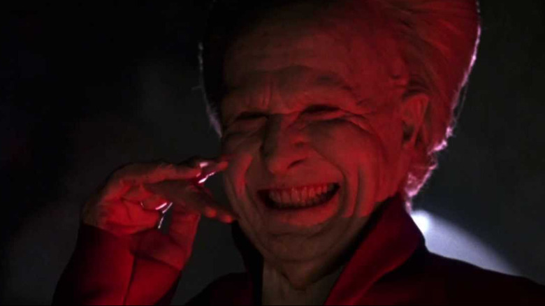 Old Dracula smiling in red light