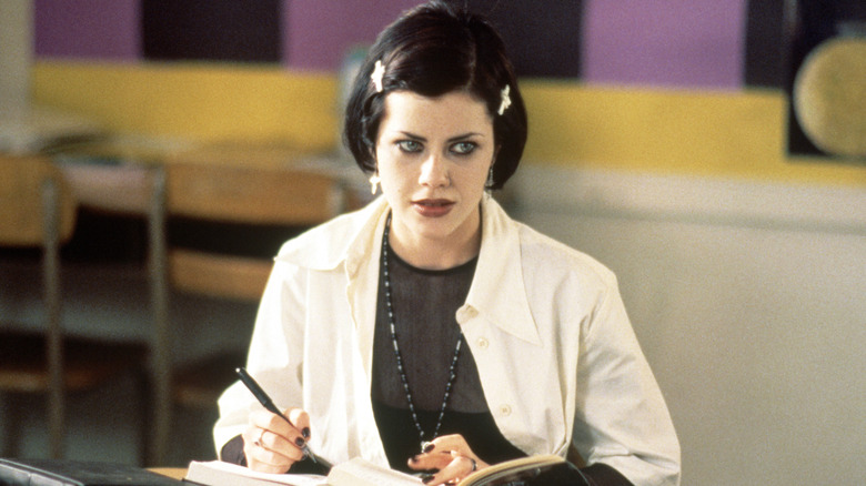 Nancy sitting at her desk in The Craft