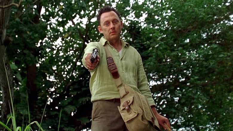 Ben points a gun