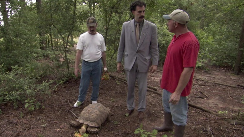 Borat standing in the woods