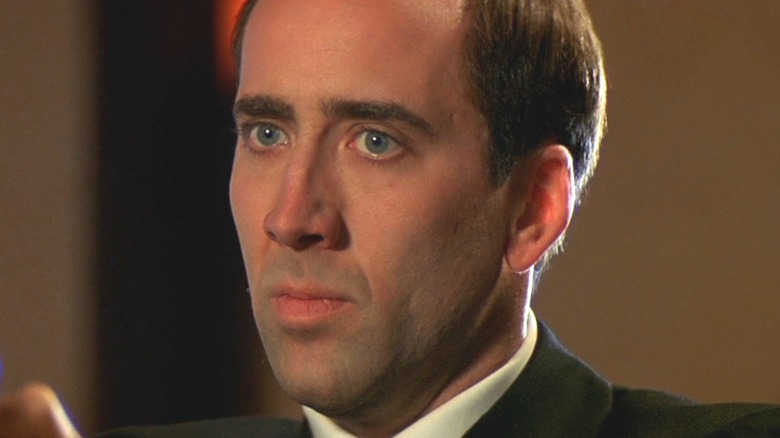 Nicolas Cage as Castor Troy in priest garb