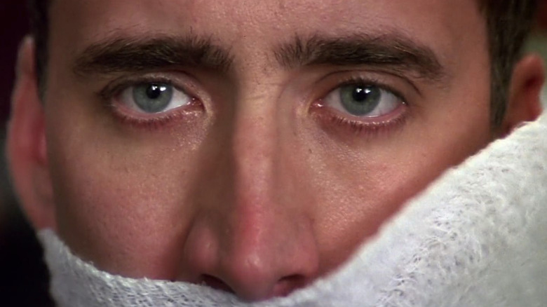 Nicolas Cage has bandages taken off his face