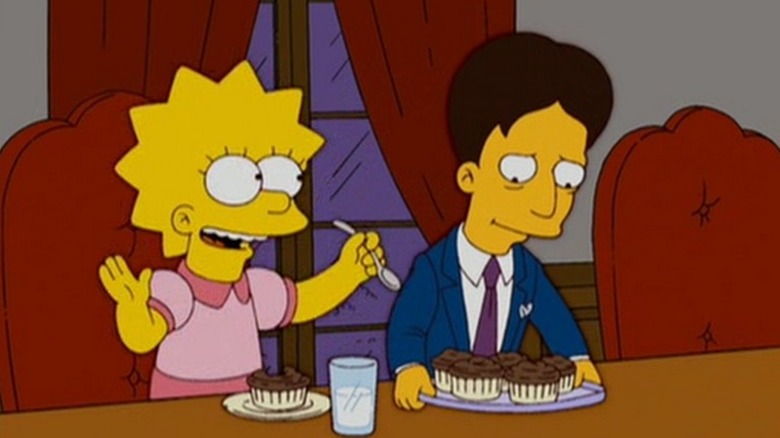 Lisa Simpson sitting at a dinner table next to Michael D'Amico in "The Mook, the Chef, the Wife and Her Homer" (2006)
