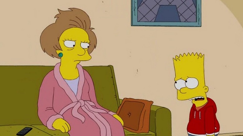 Edna Krabappel sitting on her couch while Bart Simpson talks to her in "Bart Gets a Z" (2009)