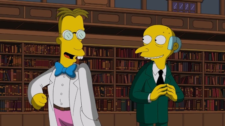 Professor Frink speaking to Mr. Burns in front of a bookshelf in "Frink Gets Testy" (2018)