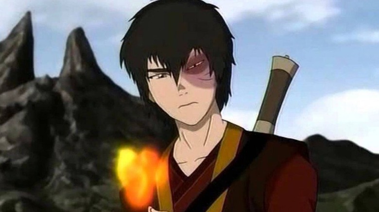 A frowning Zuko firebending