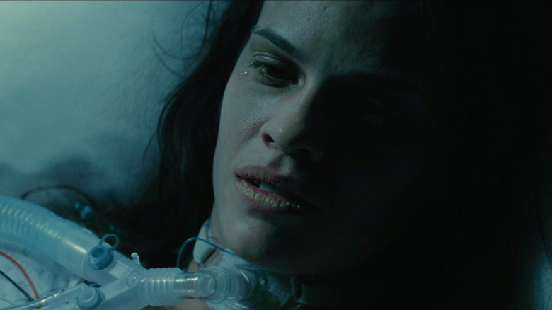 Maggie laying in hospital bed