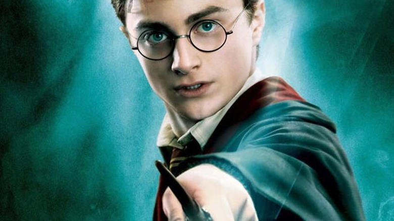 Harry Potter brandishing a wand