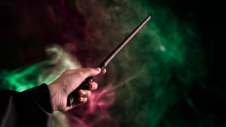 Hand brandishing a Harry Potter magic wand