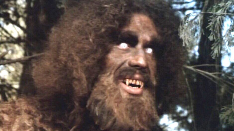 Andre the Giant, dressed as Bigfoot, shows his fangs