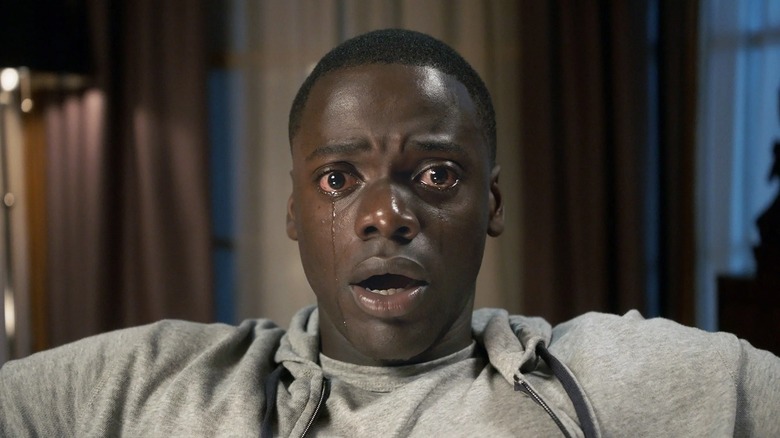 Chris sits trapped in a chair in "Get Out" (2017)