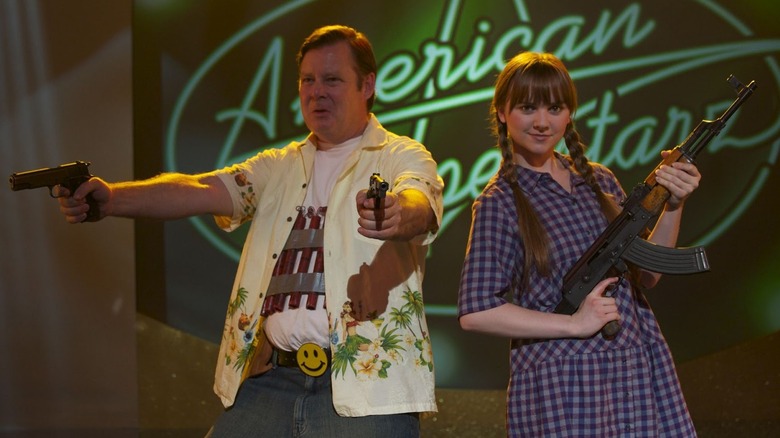 Frank and Roxy draw their guns on the reality talent show in "God Bless America" (2012)