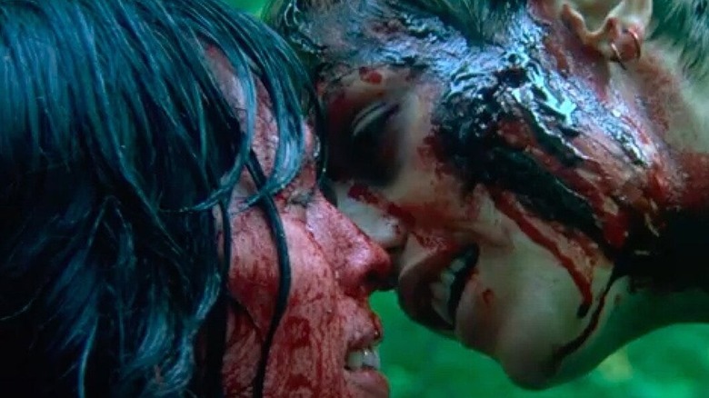 Alex and Marie share a bloody kiss in "High Tension" (2003)