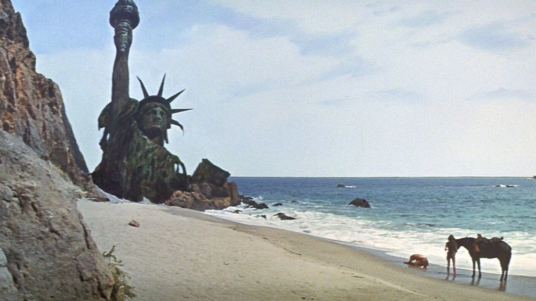 Taylor falls to his knees in front of the Statue of Liberty in "Planet of the Apes" (1968)