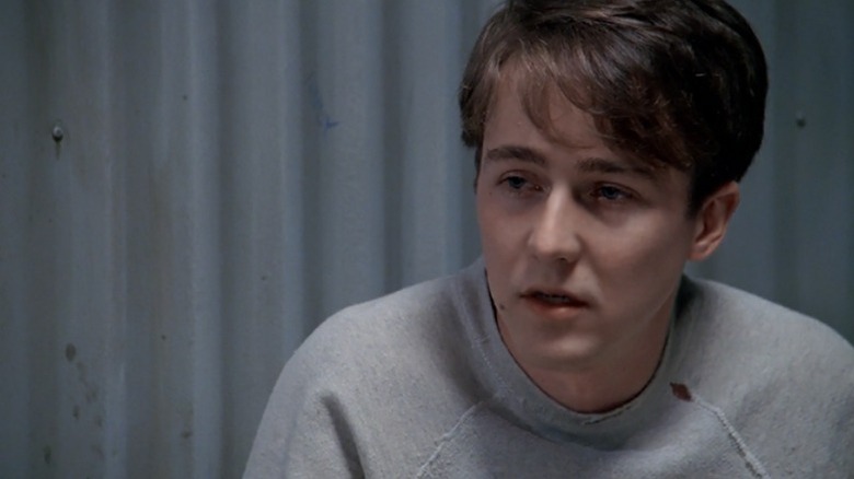 Aaron Stampler sits wearing a gray sweater in "Primal Fear" (1996)