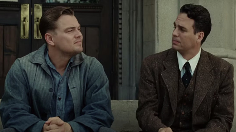 Andrew and Dr. Sheehan sit on the hospital steps in "Shutter Island" (2010)