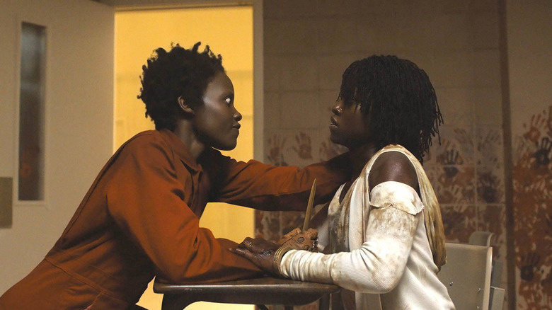 Red strangles Adelaide in "Us" (2019)