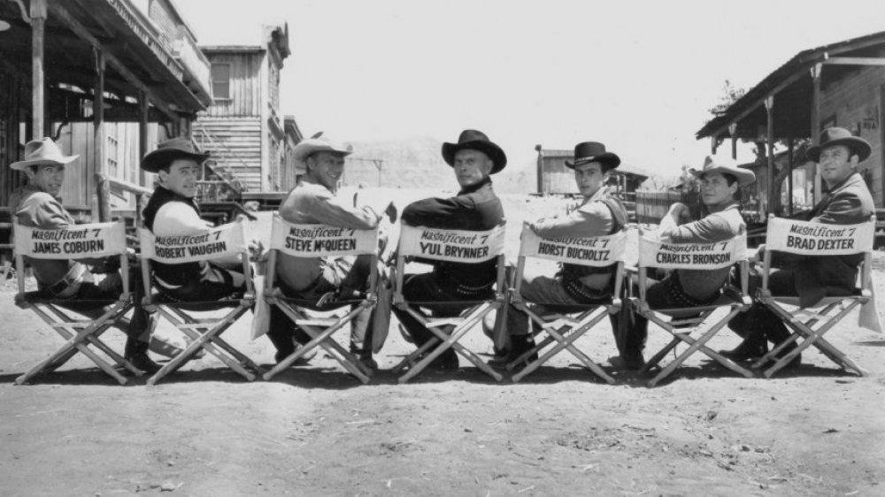 the cast of 1960's The Magnificent Seven in their actors' chairs