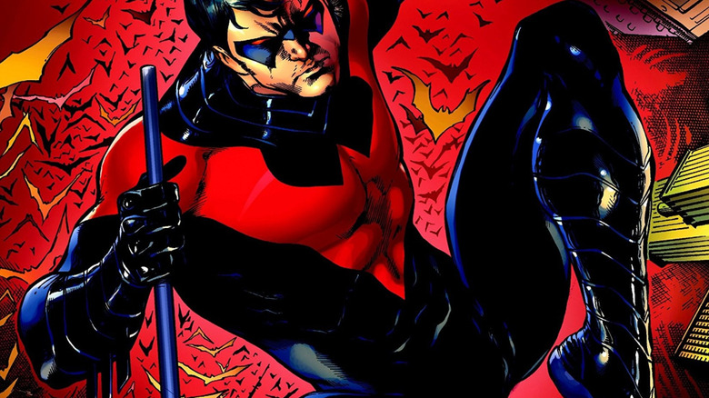 Nightwing holding sticks