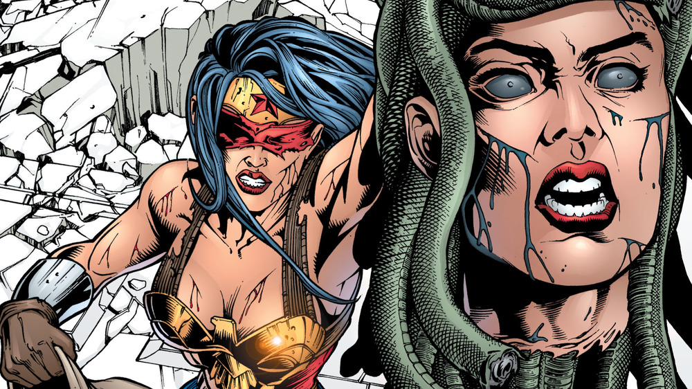 Wonder Woman hoists the severed head of Medusa