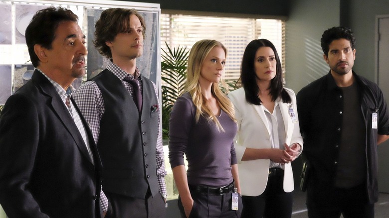 The Criminal Minds team stands in a line-up