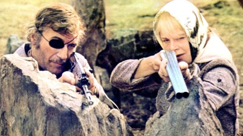 John and Ann Custance point rifles in "No Blade of Grass"