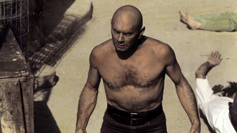 Carson walks away from a group of bodies in "The Ultimate Warrior"