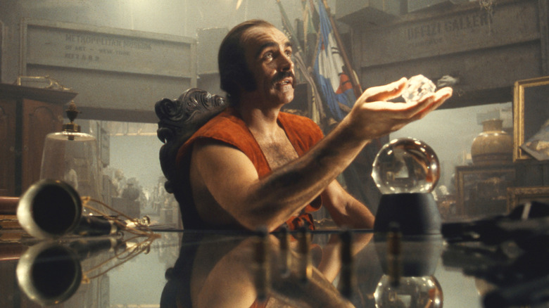 Zed examines a stone in "Zardoz"