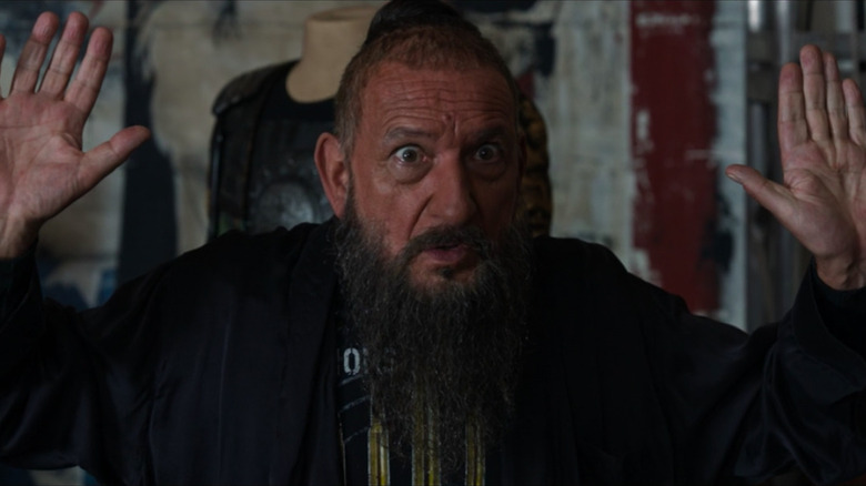 A surprised Trevor Slattery puts his hands up