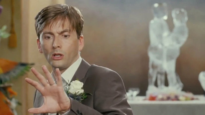 James examines hand at wedding
